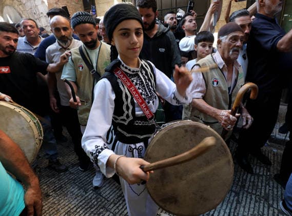 Mawlid al-Nabi in Nablus NABLUS, WEST BANK, PALESTINE - AUGUST 25: Palestinian religious figures and residents take part in a street procession to mark Mawlid al-Nabi, the anniversary of the birth of Prophet Muhammad, in Nablus, West Bank, Palestine on August 25, 2026. Participants wearing traditional clothing chant religious songs accompanied by tambourines and drums during the celebrations. Nedal Eshtayah Anadolu Nablus West Bank. Editorial use only. Please get in touch for any other usage.  Copyright: x2026xAnadoluxNedalxEshtayahx