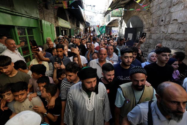 Mawlid al-Nabi in Nablus NABLUS, WEST BANK, PALESTINE - AUGUST 25: Palestinian religious figures and residents take part in a street procession to mark Mawlid al-Nabi, the anniversary of the birth of Prophet Muhammad, in Nablus, West Bank, Palestine on August 25, 2026. Participants wearing traditional clothing chant religious songs accompanied by tambourines and drums during the celebrations. Nedal Eshtayah Anadolu Nablus West Bank. Editorial use only. Please get in touch for any other usage.  Copyright: x2026xAnadoluxNedalxEshtayahx