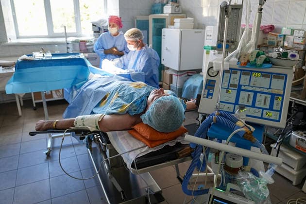August 25, 2026, Chernihiv, Chernihiv Oblast, Ukraine: A military man is laying on an operation table in an operation room with two surgeons at a military hospital in Chernihiv, north of Kyiv, Ukraine, on August 25, 2026. Chernihiv Ukraine  - ZUMAa252 20260825_zip_a252_003 Copyright: xDavidxAllignonx