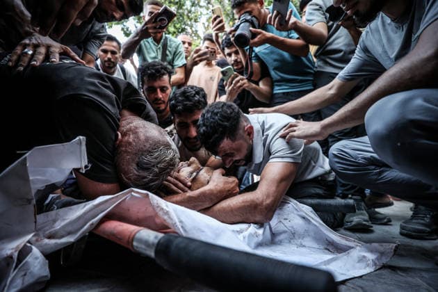 Three Palestinians lost their lives following Israeli attack on Jabalia refugee camp in Gaza GAZA CITY, GAZA, PALESTINE - AUGUST 25: (EDITOR S NOTE: Image depicts death) Relatives of Palestinians, who lost their lives following the Israeli attack on Jabalia refugee camp, mourn as the bodies are brought to al-Shifa Hospital for funeral process in Gaza City, Gaza, Palestine on August 25, 2026. Ali Jadallah Anadolu Gaza City Gaza. Editorial use only. Please get in touch for any other usage.  Copyright: x2026xAnadoluxAlixJadallahx