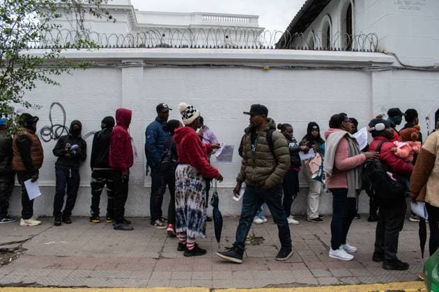 August 25, 2026, Santiago, Chile: SANTIAGO, CHILE, AUGUST 25, 2026: Haitian citizens gather at the Consulate of Haiti in Santiago to complete paperwork related to the regularization of their immigration status in Chile. Santiago Chile  - ZUMAq101 20260825_zna_q101_143 Copyright: xVicentexAsenciox