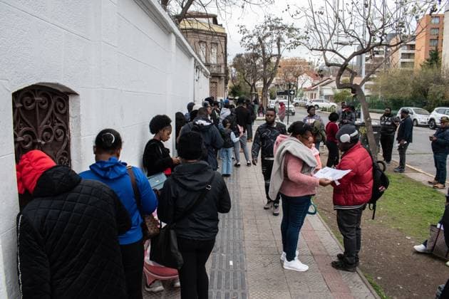 August 25, 2026, Santiago, Chile: SANTIAGO, CHILE, AUGUST 25, 2026: Haitian citizens gather at the Consulate of Haiti in Santiago to complete paperwork related to the regularization of their immigration status in Chile. Santiago Chile  - ZUMAq101 20260825_zna_q101_145 Copyright: xVicentexAsenciox