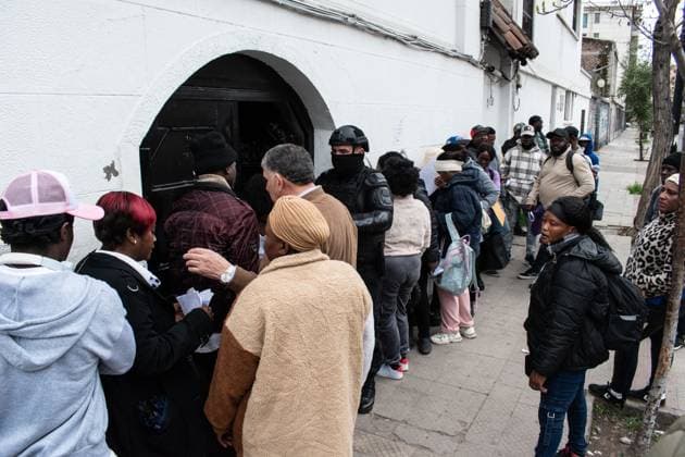 August 25, 2026, Santiago, Chile: SANTIAGO, CHILE, AUGUST 25, 2026: Haitian citizens gather at the Consulate of Haiti in Santiago to complete paperwork related to the regularization of their immigration status in Chile. Santiago Chile  - ZUMAq101 20260825_zna_q101_147 Copyright: xVicentexAsenciox