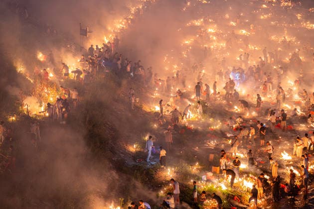 KAILI, CHINA - AUGUST 25: People burn paper offerings in designated areas to pay tribute to their departed loved ones ahead of the Zhongyuan Festival (Ghost Festival) on August 25, 2026 in Kaili, Guizhou Province of China. The Ghost Festival, also known as Zhongyuan Festival, is a traditional festival for paying respect to the dead.  Copyright: xVCGx 111662157018