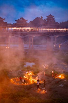 KAILI, CHINA - AUGUST 25: People burn paper offerings in designated areas to pay tribute to their departed loved ones ahead of the Zhongyuan Festival (Ghost Festival) on August 25, 2026 in Kaili, Guizhou Province of China. The Ghost Festival, also known as Zhongyuan Festival, is a traditional festival for paying respect to the dead.  Copyright: xVCGx 111662157015