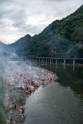 KAILI, CHINA - AUGUST 25: People burn paper offerings in designated areas to pay tribute to their departed loved ones ahead of the Zhongyuan Festival (Ghost Festival) on August 25, 2026 in Kaili, Guizhou Province of China. The Ghost Festival, also known as Zhongyuan Festival, is a traditional festival for paying respect to the dead.  Copyright: xVCGx 111662157007