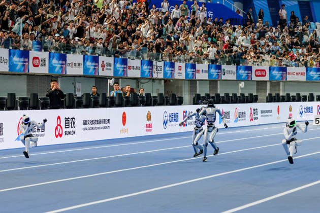 BEIJING, CHINA - AUGUST 25: Robots compete in the 100-meter small group event on day 4 of the 2nd World Humanoid Robot Games at National Speed Skating Oval on August 25, 2026 in Beijing, China.  Copyright: xVCGx 111662143567