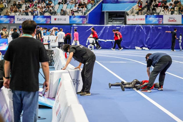 BEIJING, CHINA - AUGUST 25: A humanoid robot soccer player runs onto the track on day 4 of the 2nd World Humanoid Robot Games at National Speed Skating Oval on August 25, 2026 in Beijing, China.  Copyright: xVCGx 111662143563