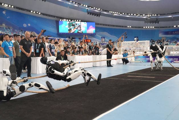 BEIJING, CHINA - AUGUST 25: Humanoid robots compete in a heavyweight tug-of-war match on day 4 of the 2nd World Humanoid Robot Games at National Speed Skating Oval on August 25, 2026 in Beijing, China.  Copyright: xVCGx 111662236768