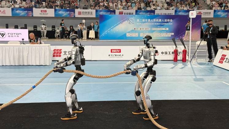 BEIJING, CHINA - AUGUST 25: Humanoid robots compete in a heavyweight tug-of-war match on day 4 of the 2nd World Humanoid Robot Games at National Speed Skating Oval on August 25, 2026 in Beijing, China.  Copyright: xVCGx 111662232273