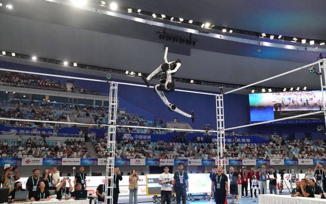 BEIJING, CHINA - AUGUST 25: A robot competes in the Standing High Jump final on day 4 of the 2nd World Humanoid Robot Games at National Speed Skating Oval on August 25, 2026 in Beijing, China.  Copyright: xVCGx 111662240485