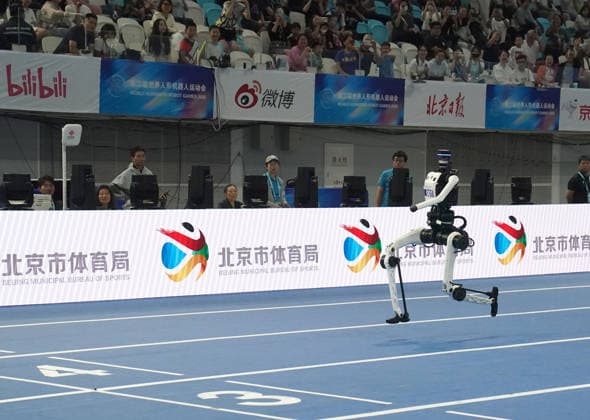 BEIJING, CHINA - AUGUST 25: Robots from Team Tiangong Ultra compete in the 4x100 meter relay final on day 4 of the 2nd World Humanoid Robot Games at National Speed Skating Oval on August 25, 2026 in Beijing, China.  Copyright: xVCGx 111662238723