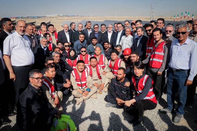 August 25, 2026, Tehran, Iran: Iranian President Masoud Pezeshkian poses for a group photograph with officials and people wearing red safety vests during the inauguration of two solar power plants in Tehran Province, Iran, on August 25, 2026. The projects comprise the 63-megawatt Ghaed Shahid solar power plant and the 32-megawatt Shohadaye Lamerd solar power plant, according to the Iranian presidentÃ¢â‚¬â ¢s office. Tehran Iran - ZUMAi98_ 20260825_zih_i98_008 Copyright: xIranianxPresidencyx