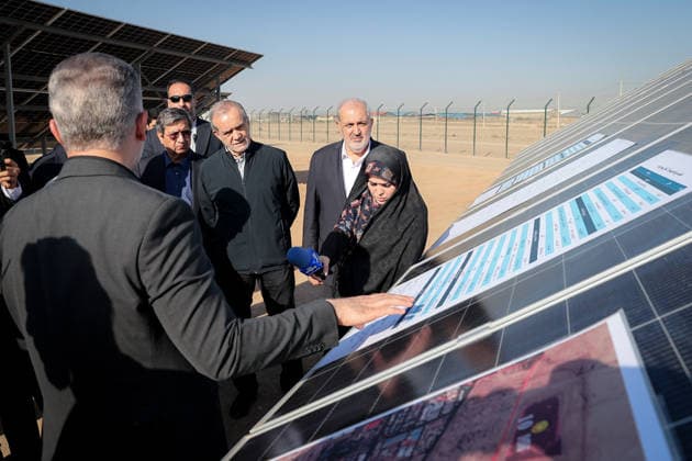 August 25, 2026, Tehran, Iran: Iranian President Masoud Pezeshkian and officials inspect a display beside solar panels during the inauguration of two solar power plants in Tehran Province, Iran, on August 25, 2026. The projects comprise the 63-megawatt Ghaed Shahid solar power plant and the 32-megawatt Shohadaye Lamerd solar power plant, according to the Iranian presidentÃ¢â‚¬â ¢s office. Tehran Iran - ZUMAi98_ 20260825_zih_i98_011 Copyright: xIranianxPresidencyx