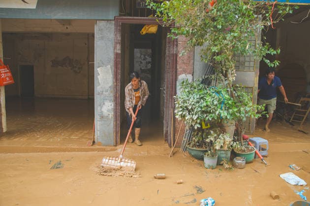 CHONGZUO, CHINA - AUGUST 26: Residents clear mud to restore production and daily life after floodwaters receded on August 26, 2026 in Longzhou County, Chongzuo City, Guangxi Zhuang Autonomous Region of China. The area was hit by floods caused by heavy rainfall from Typhoon Narra and upstream water flow.  Copyright: xChinaxNewsxServicex 111662262395