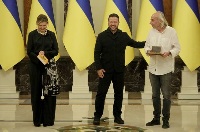 Braty Hadiukiny rock band member Ihor Melnychuk accepts the National Legend of Ukraine award on behalf of his late bandmate Serhii Kuzminskyi from First Lady Olena Zelenska and Ukrainian President Volodymyr Zelenskyy (2nd L) during a ceremony at the Mariinskyi Palace, Kyiv, Ukraine, August 25, 2026. Established in 2021, the President of Ukraine’s National Legend of Ukraine award honours individuals who have contributed to the establishment of an independent Ukraine, the defence of the country and service to the Ukrainian people, the development of the national economy, science, education, culture, the arts, sport and health care, as well as active charitable and civic activities. This year, 18 recipients included military personnel, artists  Copyright: xYuliiaxOvsiannikovax