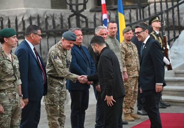 RECORD DATE NOT STATED President of Ukraine Volodymyr Zelenskyy (C) shakes hands with a foreign guest in the presence of UK Prime Minister Andy Burnham, who chose Ukraine for his first foreign visit since taking office, during an official meeting marking the 35th anniversary of Ukraine’s independence at the Small Residence of the President of Ukraine, Kyiv, Ukraine, on August 24, 2026 (Photo by Yevhen Kotenko Ukrinform) President of Ukraine meets with UK Prime Minister  Copyright: xYevhenxKotenkox