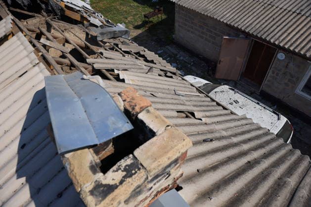 RUSSIA, LUGANSK - AUGUST 26, 2026: The roof of a residential house suffers damage following a strike by the Armed Forces of Ukraine. Alexander Reka TASS  96655062