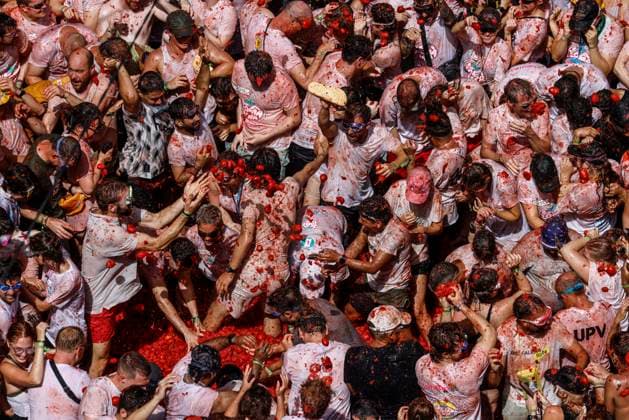 Celebration of La Tomatina in Bunol, Valencia, 2026 Several participants in the La Tomatina festival in Bunol celebrate during the event on August 26, 2026, in Bunol, Valencia, Valencian Community, Spain. La Tomatina is always held on the last Wednesday of August, as part of Bunol’s festival week, and involves participants throwing tomatoes at one another. Seven trucks were needed to transport the 150,000 kilos of tomatoes thrown during this unique battle, which celebrates its 79th anniversary this year. AUGUST 26, 2026 FESTIVAL TRADITION CULTURE Bunol, Valencia, Valencian Community Bunol, Valencia, Valencian Community, Spain  Copyright: xRoberxSolsonax 7732780