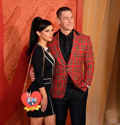 Cast member John Cena and his wife Shay Shariatzadeh attend Ketchup Entertainment s premiere of the animated quirky comedy Coyote vs. Acme at the Westwood Village Theater in Los Angeles on Wednesday, August 26, 2026. Storyline: A story set in the ACME warehouse, the manufacturer of anything and everything used by the Looney Tunes characters.  LAP2026082627 JIMxRUYMEN