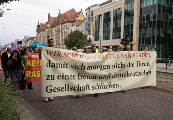 Migra-Streik rally against racism and social exclusion in Germany s Magdeburg MAGDEBURG, GERMANY - AUGUST 27: Business owners, organizers and supporters take part in a rally against racism and social exclusion outside the Saxony-Anhalt state parliament at Domplatz in Magdeburg, Germany, on August 27, 2026. The rally was held as part of the Migra-Streik, during which participating migrant-run businesses across Magdeburg voluntarily closed from 10 a.m. to 3 p.m. to call for solidarity and the protection of a free and democratic society, ahead of Saxony-Anhalt s state election on September 6. Somaya Abdelrahman Anadolu Magdeburg Germany. Editorial use only. Please get in touch for any other usage.  Copyright: x2026xAnadoluxSomayaxAbdelrahmanx
