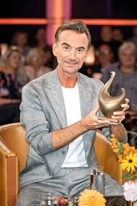 MDR Riverboat host, singer, and actor Florian Silbereisen with the Golden Hen award during the taping of the MDR talk show Riverboat on August 28, 2026, at Mediacity Leipzig 20260828SFL0023