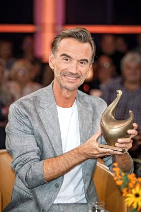 MDR Riverboat host, singer, and actor Florian Silbereisen with the Golden Hen award during the taping of the MDR talk show Riverboat on August 28, 2026, at Mediacity Leipzig 20260828SFL0024