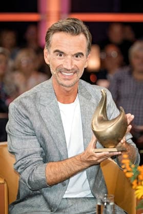 MDR Riverboat host, singer, and actor Florian Silbereisen with the Golden Hen award during the taping of the MDR talk show Riverboat on August 28, 2026, at Mediacity Leipzig 20260828SFL0025