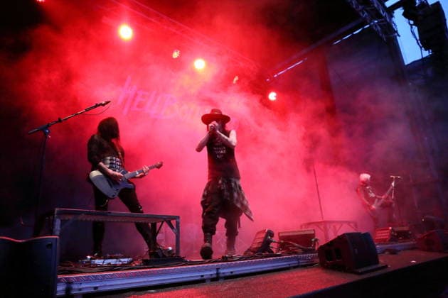 Vulture King, Matteo vDiva Fabbiani, and Raul Sanchez (from left), from the band Hell Boulevard, performing as the opening act for Mono Inc. at an open-air concert at the Waschhaus in Potsdam on August 28, 2026. Hell Boulevard Concert in Potsdam