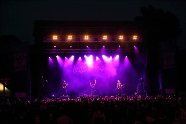 Vulture King, Jan Hangman, Matteo vDiva Fabbiani, and Raul Sanchez (from left to right), from the band Hell Boulevard, performing as the opening act for Mono Inc. at an open-air concert at the Waschhaus in Potsdam on August 28, 2026. Hell Boulevard Concert in Potsdam