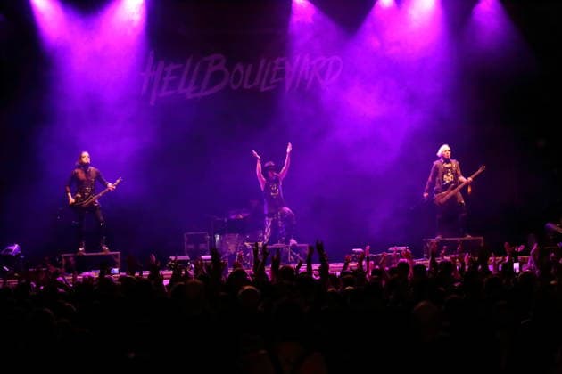 Vulture King, Jan Hangman, Matteo vDiva Fabbiani, and Raul Sanchez (from left to right), from the band Hell Boulevard, performing as the opening act for Mono Inc. at an open-air concert at the Waschhaus in Potsdam on August 28, 2026. Hell Boulevard Concert in Potsdam