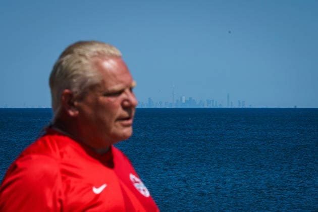 August 29, 2026, Grimsby, On, Canada: The Toronto skyline is seen across Lake Ontario as Ontario Premier Doug Ford does an interview prior to the unveiling of a sign for Lake Ontario at Fifty Point Conservation Area in Grimsby, Ont., on Saturday, Aug. 29, 2026. Grimsby Canada  - ZUMAc35_ 20260829_zaf_c35_035 Copyright: xKeitoxNewmanx