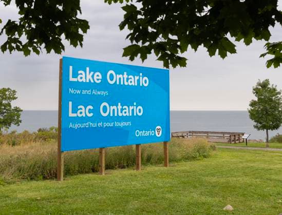 (260830) -- HAMILTON, Aug. 30, 2026 -- An English-French bilingual sign reading Lake Ontario Now and Always is pictured at a lakeside conservation area in Hamilton, Ontario, Canada, on Aug. 30, 2026. Canadian Prime Minister Mark Carney said Thursday that the name Lake Ontario carries a long history and that Canadians will always use this name regardless of external changes. The Canadian prime minister made the remarks after U.S. President Donald Trump signed an executive order earlier on Thursday, directing the Department of the Interior to rename the lake Lake America, as trade tensions between the United States and Canada have been escalating. (Photo by Xinhua) CANADA-ONTARIO-HAMILTON-LAKE ONTARIO-NAME ZouxZheng 