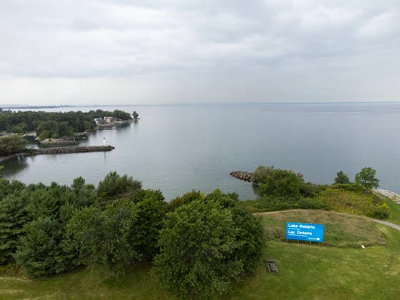 (260830) -- HAMILTON, Aug. 30, 2026 -- An aerial drone photo taken on Aug. 30, 2026 shows an English-French bilingual sign reading Lake Ontario Now and Always at a lakeside conservation area in Hamilton, Ontario, Canada. Canadian Prime Minister Mark Carney said Thursday that the name Lake Ontario carries a long history and that Canadians will always use this name regardless of external changes. The Canadian prime minister made the remarks after U.S. President Donald Trump signed an executive order earlier on Thursday, directing the Department of the Interior to rename the lake Lake America, as trade tensions between the United States and Canada have been escalating. (Photo by Xinhua) CANADA-ONTARIO-HAMILTON-LAKE ONTARIO-NAME ZouxZ 