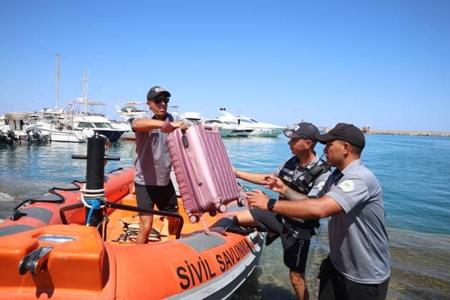 Search and rescue continues for 18 missing after passenger vessel capsizes Off Kyrenia KYRENIA, TRNC - AUGUST 31: Search and rescue personnel handle recovered belongings at a marina as search and rescue operations continue by sea and air for 18 people who went missing after a passenger vessel capsized off the coast of Kyrenia in the Turkish Republic of Northern Cyprus (TRNC) on August 31, 2026. The vessel began taking on water from its bow shortly after departing Kyrenia at noon on Sunday and capsized while attempting to return to the port. Search and rescue efforts for 18 people are ongoing, with special operations police also taking part in the operation. Ali Ruhluel Anadolu Kyrenia Cyprus. Editorial use only. Please get in touch for an  Copyright: x2026xAnadoluxAlixRuhluelx