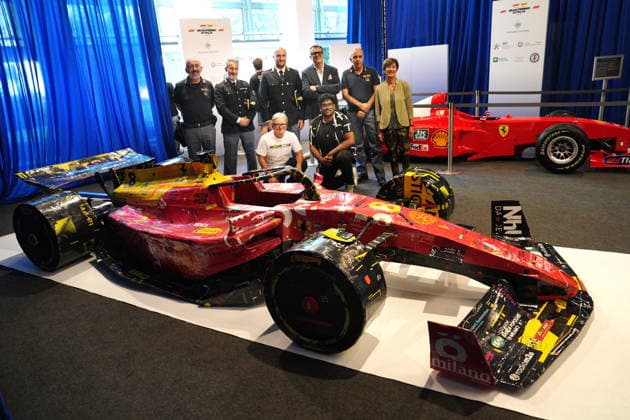 IPA87972994 - Milan, August 31, 2026, ACI, A pair of Ferraris made of papier-mâché by the Faccia Vista Association is on display alongside Michael Schumacher’s Ferrari F399, which was transported in a police tow truck and is now on display at Corso Venezia, headquarters of the Automobile Club Italiano in Milan, to promote the Italian Grand Prix in Monza. Pictured is Matteo Perego, president.  Copyright: xDuilioxPiaggesix xDuilioxPiaggesix 87972994