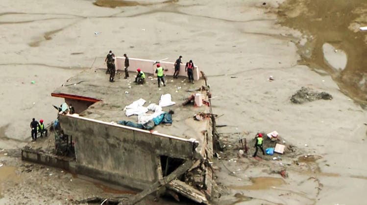 RECORD DATE NOT STATED Rescue operations are underway in the flash-flood-ravaged areas Rasuwa Nepal , Aug 31 (ANI): Nepal Army personnel at the roof of a house with the bodies of victims during a rescue operation, in Rasuwa on Monday. (ANI Video Grab) Rasuwa Nepal Copyright: xANIx ANI_20260831400