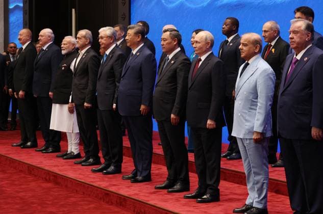 Kyrgyzstan SCO Summit 9232468 01.09.2026 From left, Azerbaijani President Ilham Aliyev, Belarusian President Alexander Lukashenko, Indian Prime Minister Narendra Modi, Iranian President Masoud Pezeshkian, Kazakh President Kassym-Jomart Tokayev, Chinese President Xi Jinping, Kyrgyz President Sadyr Japarov, Russian President Vladimir Putin, Togolese Prime Minister Faure Gnassingbe, Pakistani Prime Minister Shehbaz Sharif, Armenian Prime Minister Nikol Pashinyan and Tajik President Emomali Rahmon pose for a family photo before a meeting in the Shanghai Cooperation Organization (SCO) Plus format in Bishkek, Kyrgyzstan. Vyacheslav Prokofiev Sputnik Bishkek Kyrgyzstan  Copyright: xVyacheslavxProkofievx