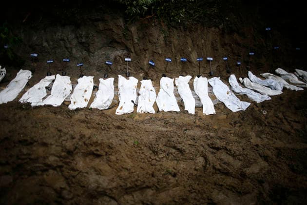 September 1, 2027, Kathmandu, Nepal: Bodies of unidentified flood victims are pictured at a temporary burial site at Gokarna in Kathmandu, Nepal, on Tuesday, September 1, 2026. Authorities have begun temporarily burying unidentified remains recovered from the devastating floods. DNA samples, photographs, and other identifying information are being collected before burial so families can later identify and reclaim the remains for final rites. The disaster has killed more than 1,000 people in Nepal, with thousands still missing. Kathmandu Nepal - ZUMAg200 20270901_zap_g200_005 Copyright: xSkandaxGautamx