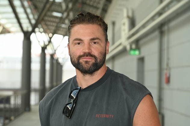 Actor Benjamin Heinrich poses at the big fan gathering and awards ceremony for the RTL series *Unter Uns*