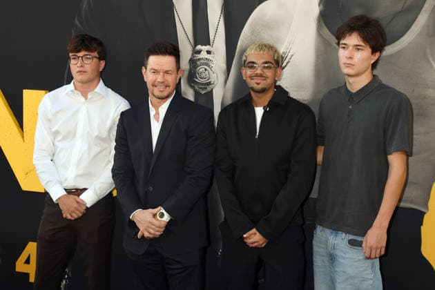 LOS ANGELES, CA - SEPTEMBER 1: Michael Wahlberg, Mark Wahlberg, N3on and Brendan Joseph Wahlberg at the LA premiere of By Any Means on September 1, 2026 at Paramount Theatre in Los Angeles, California. Copyright: xJeffreyxMayerx