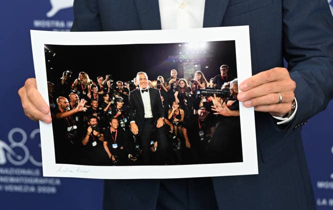 George Clooney attends Golden Lion for Lifetime Achievement photocall during 83rd Venice International Film Festival Featuring: George Clooney holds photo Where: Venice, Italy When: 02 Sep 2026 Credit: Cover Images EDITORIAL USE ONLY. NOT FOR USE BY NEWSPAPERS BASED IN THE UK. Copyright: xx coverimg55966556
