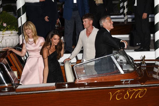 IPA88040636 - Venice: George Clooney arrives at the dock for the Golden Lion award ceremony and leaves with the prize; pictured are George Clooney, Amal Alamuddin, and Laura Den  Copyright: xFRANCESCAxVIECELIx xFrancescaxViecelix 88040636