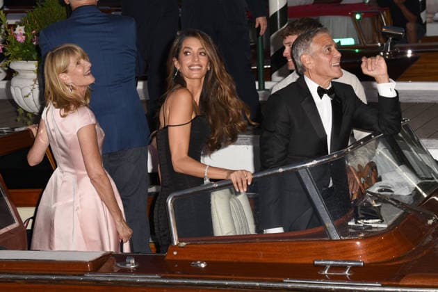 IPA88040646 - Venice: George Clooney arrives at the dock for the Golden Lion award ceremony and leaves with the prize; pictured are George Clooney, Amal Alamuddin, and Laura Den  Copyright: xFRANCESCAxVIECELIx xFrancescaxViecelix 88040646