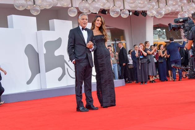 Title: 83rd Venice Film Festival Red Carpet 83rd Venice Film Festival Venice International Film Festival George Clooney on the opening red carpet George Clooney attends the Golden Lion for Lifetime Achievement red carpet with his wife Amal and poses with the award after the ceremony, accompanied in part by Laura Dern Photos by Thomas Bohlen Starface 459342 2026 09 02 Venice, Italy  Copyright: xThomasxBohlenx STAR_459342_379