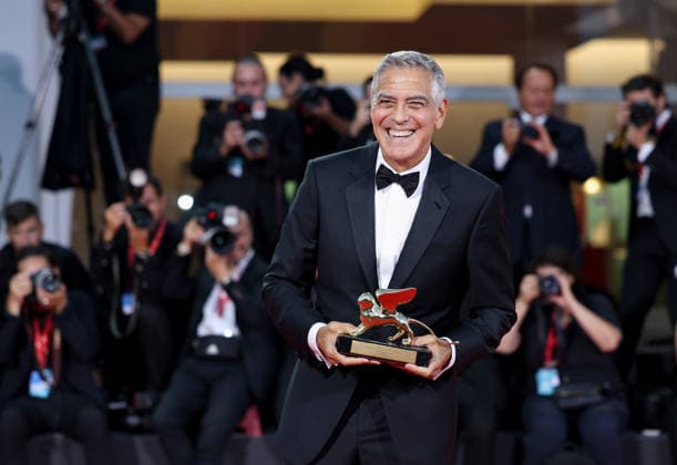 (260903) -- VENICE, Sept. 3, 2026 -- U.S. actor, director and producer George Clooney holds the Golden Lion for Lifetime Achievement at the red carpet of the 83rd Venice International Film Festival in Venice, Italy, Sept. 2, 2026. The festival opened Wednesday on Lido island in Venice, Italy. At the opening ceremony, George Clooney received the Golden Lion for Lifetime Achievement. ) ITALY-VENICE-FILM FESTIVAL-LIFETIME ACHIEVEMENT-GEORGE CLOONEY WangxKaiyan 
