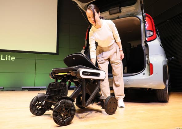 September 3, 2026, Tokyo, Japan - Japanese personal mobility company Whill unveils the new lighweight folding electric wheelchair Whill Model C Lite in Tokyo on Thursday, September 3, 2026. The new mobility weighing 18.6kg body with carbon fiver reinforced plastics parts has omni-directional wheels for front wheels and high performance battery to drive 38.5km of distance. (photo by Yoshio Tsunoda AFLO)  aflo_344739884