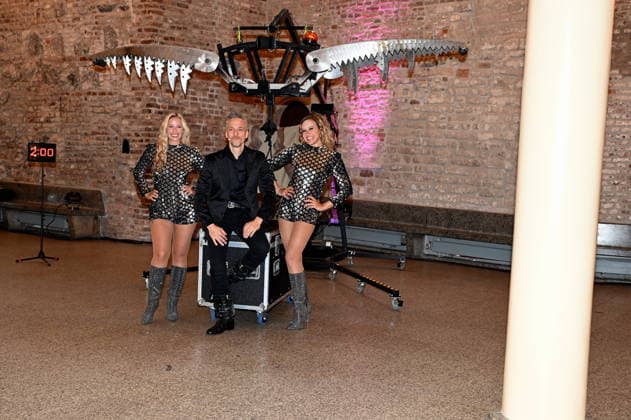 Illusionist Peter Valance poses with his assistant at the program presentation for the 11th Cologne Christmas Circus