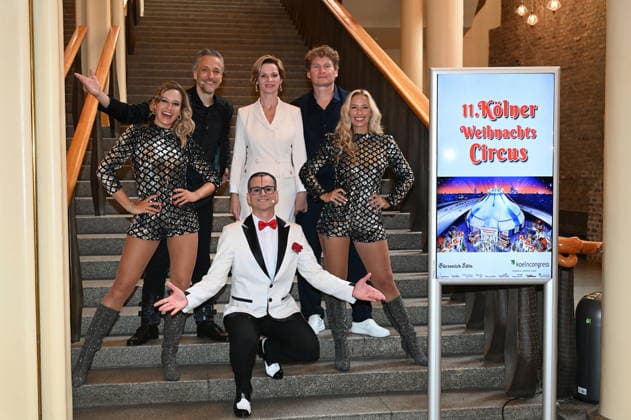 Ilja and Katja Smitt pose alongside clown Cesar Dias and illusionist Peter Valance at the program presentation for the 11th Cologne Christmas Circus