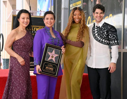 Filipina actress and singer Lea Salonga holds a replica plaque as she is joined by Ming-Na Wen, Brandy and Darren Criss (L-R) during an unveiling ceremony honoring her with the 2,855th star on the Hollywood Walk of Fame in Los Angeles on Friday, September 4, 2026.  LAP2026090404 JIMxRUYMEN